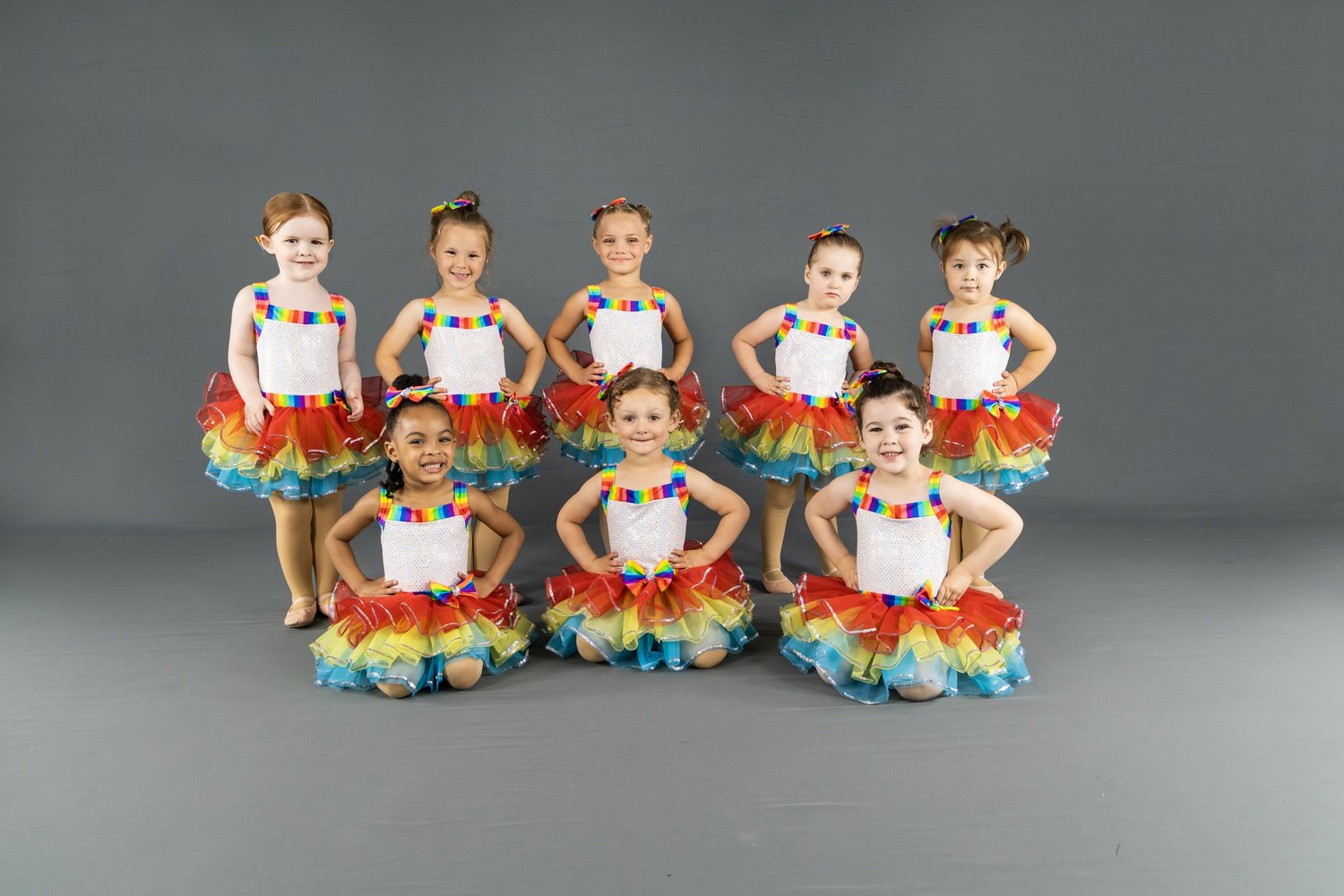 A group of young Rising Stars dancers in recital costumes